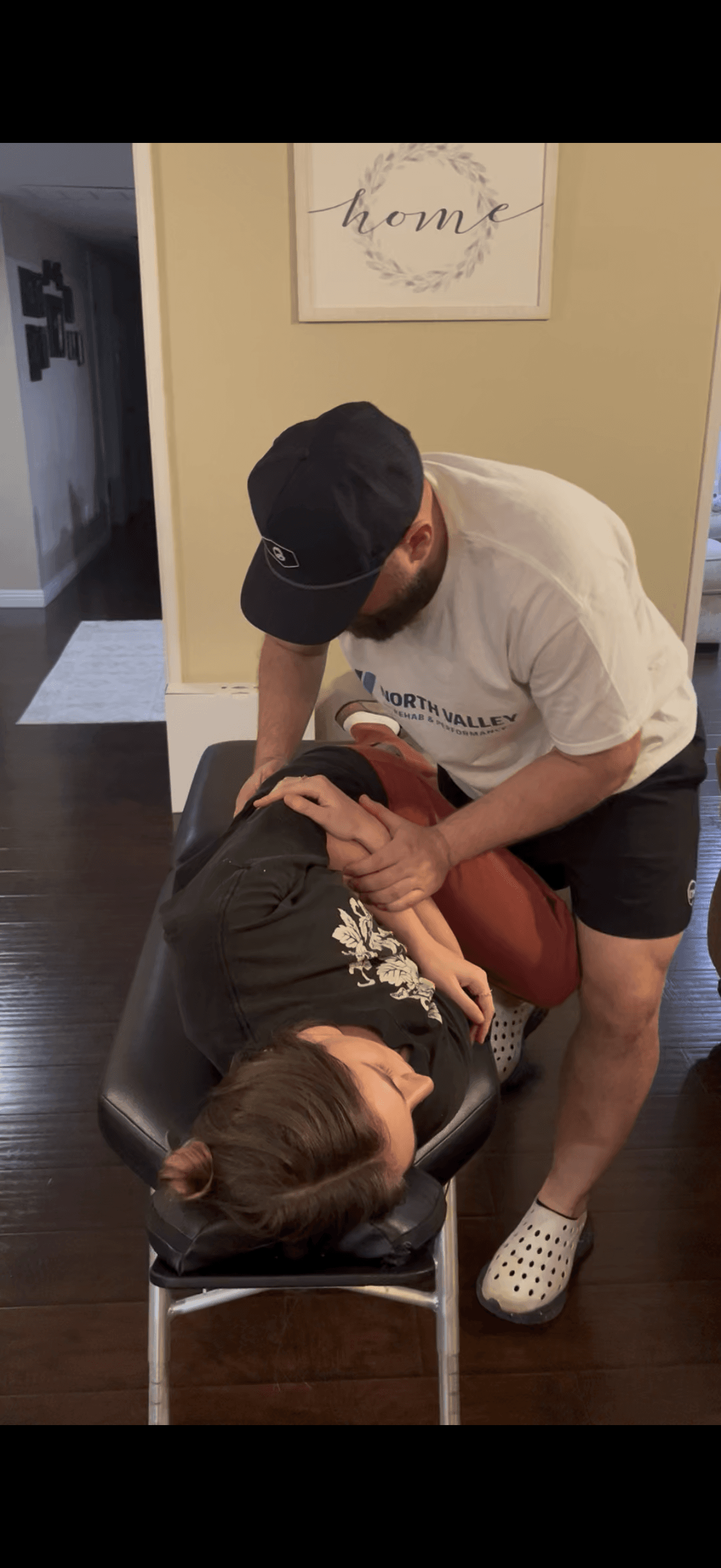 Dr. Van Poole adjusting a patient at home